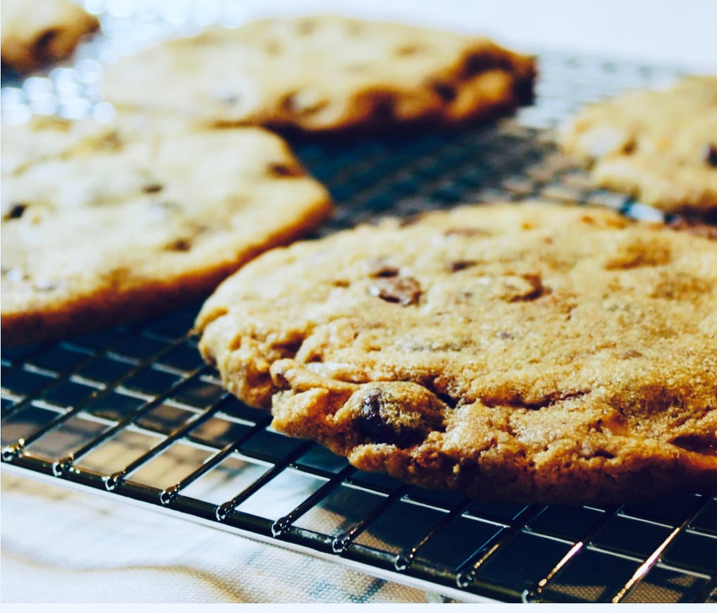 Chocolate chip cookies on a cooling rack